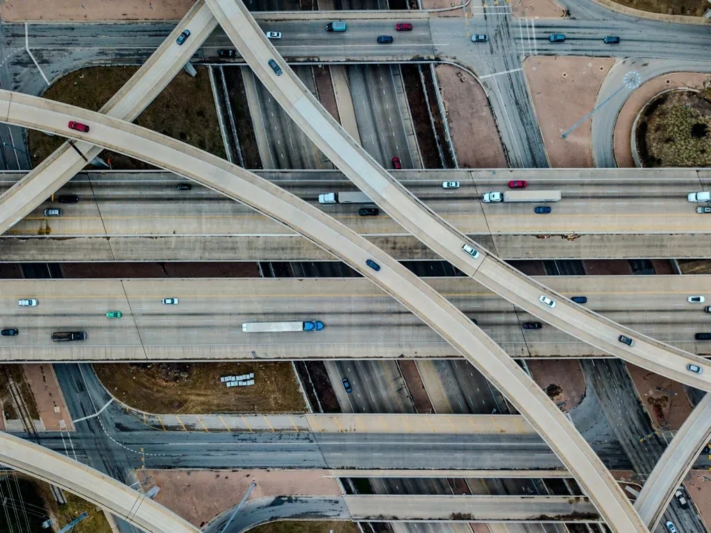 Aerial view straight down on curving freeway ramps and traffic, Austin, Texas