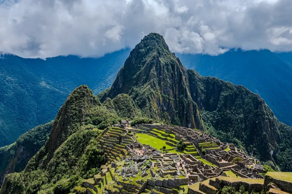 Machu Picchu's stone terraces with Huayna Picchu rising behind, Peruvian Andes