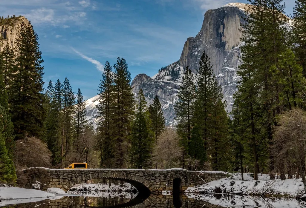 Stoneman Bridge arching below Half Dome in Yosemite Valley, California